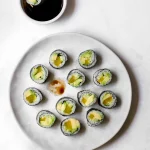 Maki sushi rolls with vegan fish, avocado, and cucumber